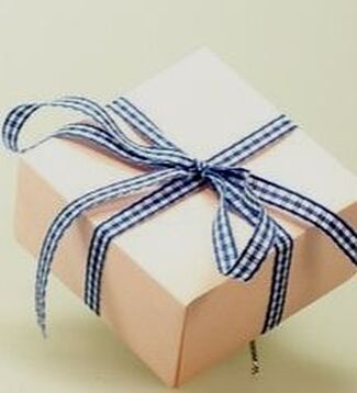 gift box wrapped with blue ribbon
